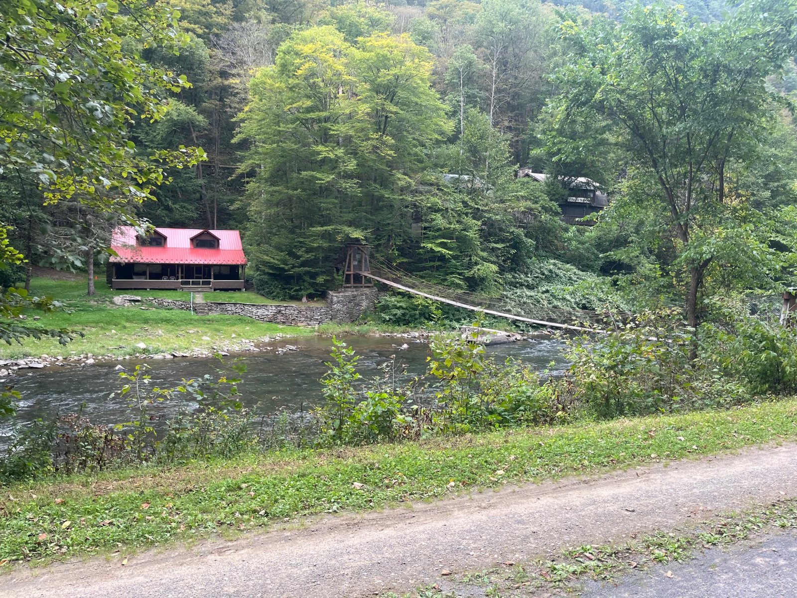 House with connecting bridge across the water